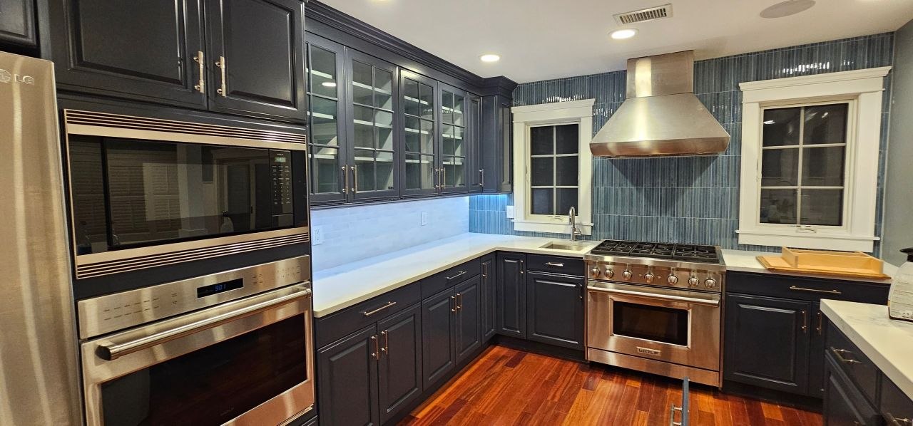 Luxury kitchen cabinets painted with Fine Paints of Europe — navy blue with gold hardware, Jersey City NJ